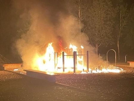 Playground equipment fully engulfed in flames