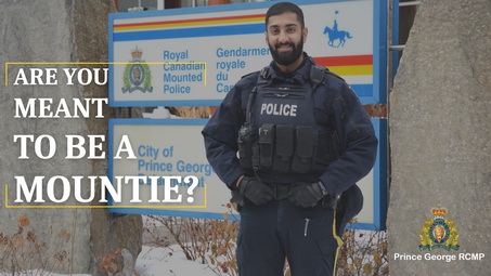 A police officer standing in front of a police station with the words "Are you meant to be a Mountie?" written beside him.