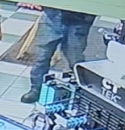 Photo of suspect’s lower body wearing blue jeans and dark boots.