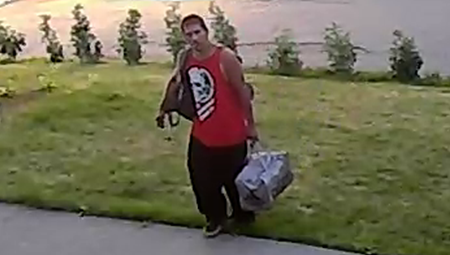 Photo of the suspect wearing a sleeveless red shirt and black pants