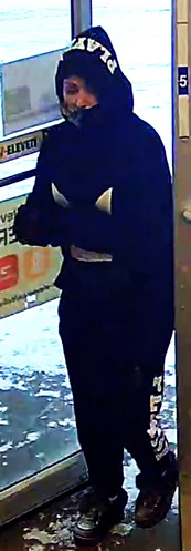 Photo of person of interest wearing black pants and jacket