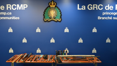 Photo of seized weapons on a table