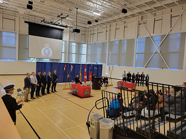 Group of experienced police officers completing their swearing in ceremony to join the RCMP.