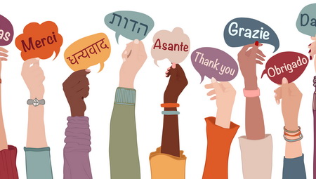 Photo of hands holding signs that say "thank you" in multiple languages.