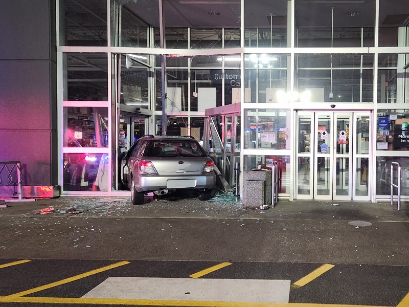 A grey car crashed into the front doors of Canadian Tire