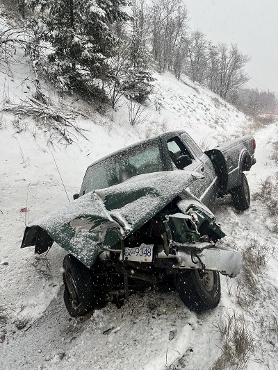 Trail motor vehicle collision during heavy snow fall.