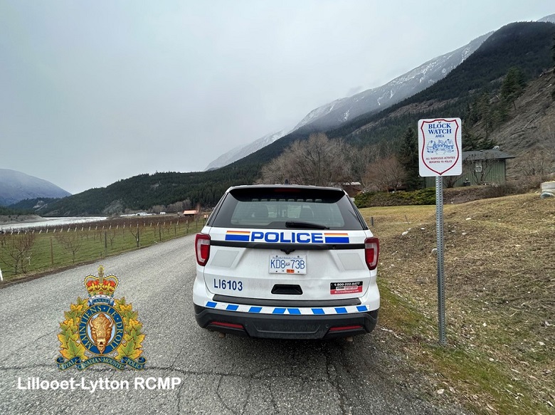 A RCMP vehicle pictured beside a Block Watch sign in Lillooet. 